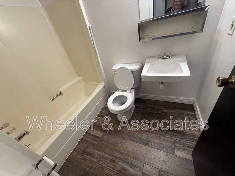 2 bed 1 bathroom apartment with Brand-new flooring.  Playground and Coin Op laundry room and off-street parking. property image