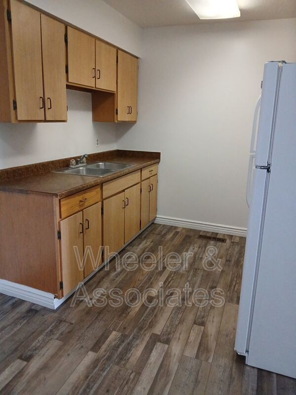 2 bed 1 bathroom apartment with Brand-new flooring.  Playground and Coin Op laundry room and off-street parking. property image