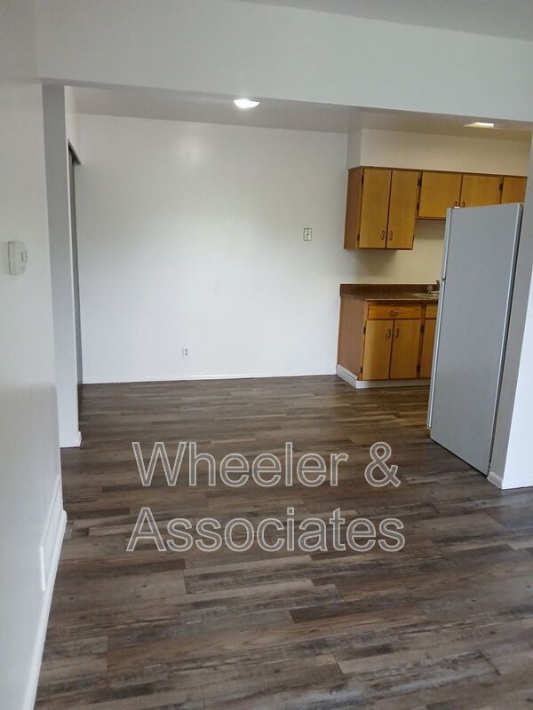 2 bed 1 bathroom apartment with Brand-new flooring.  Playground and Coin Op laundry room and off-street parking. property image