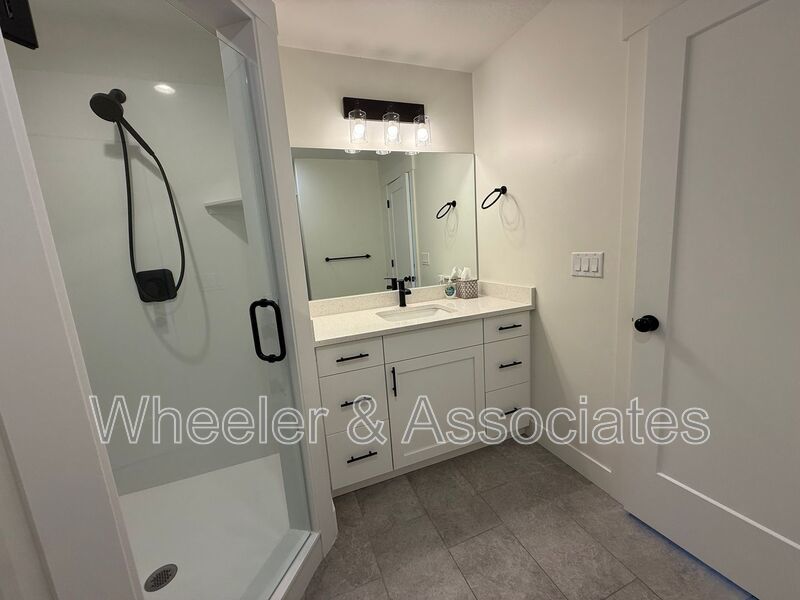 Spacious 3 bed 2 bath Condo with two .5 bathrooms, 2 car Garage and Bonus office space on Ground floor off 12th mouth of Weber Canyon. property image