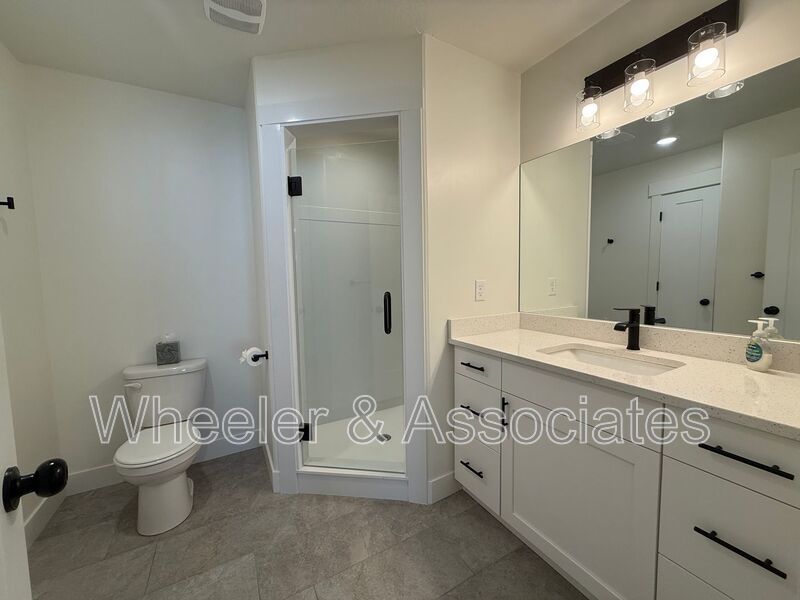 Spacious 3 bed 2 bath Condo with two .5 bathrooms, 2 car Garage and Bonus office space on Ground floor off 12th mouth of Weber Canyon. property image