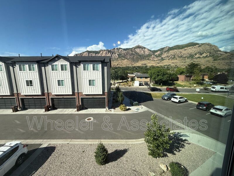 Spacious 3 bed 2 bath Condo with two .5 bathrooms, 2 car Garage and Bonus office space on Ground floor off 12th mouth of Weber Canyon. property image