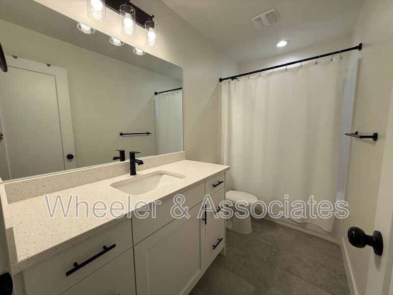 Spacious 3 bed 2 bath Condo with two .5 bathrooms, 2 car Garage and Bonus office space on Ground floor off 12th mouth of Weber Canyon. property image