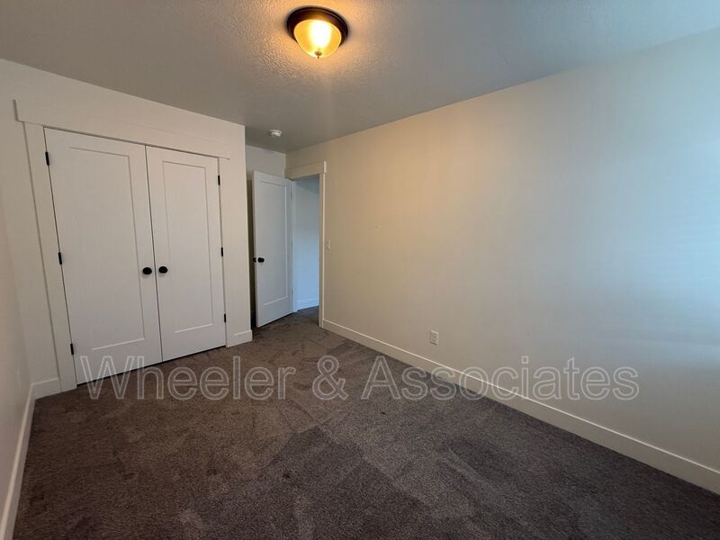 Spacious 3 bed 2 bath Condo with two .5 bathrooms, 2 car Garage and Bonus office space on Ground floor off 12th mouth of Weber Canyon. property image
