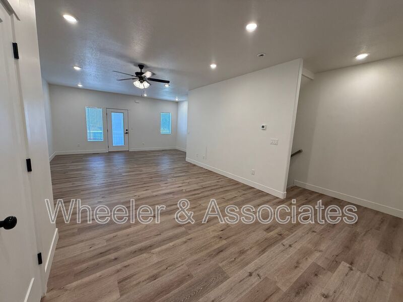 Spacious 3 bed 2 bath Condo with two .5 bathrooms, 2 car Garage and Bonus office space on Ground floor off 12th mouth of Weber Canyon. property image