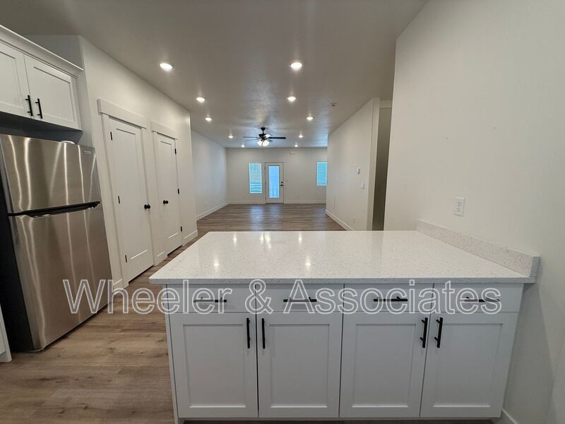 Spacious 3 bed 2 bath Condo with two .5 bathrooms, 2 car Garage and Bonus office space on Ground floor off 12th mouth of Weber Canyon. property image