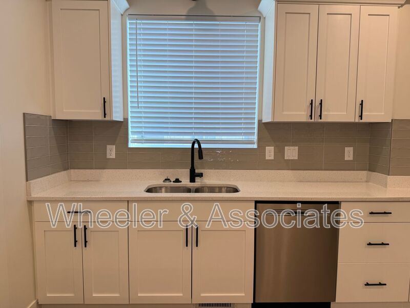 Spacious 3 bed 2 bath Condo with two .5 bathrooms, 2 car Garage and Bonus office space on Ground floor off 12th mouth of Weber Canyon. property image