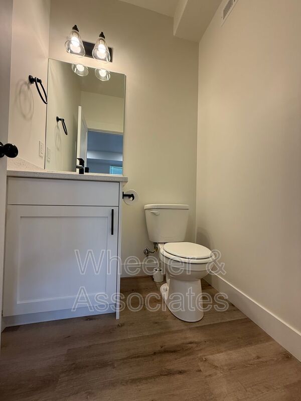 Spacious 3 bed 2 bath Condo with two .5 bathrooms, 2 car Garage and Bonus office space on Ground floor off 12th mouth of Weber Canyon. property image