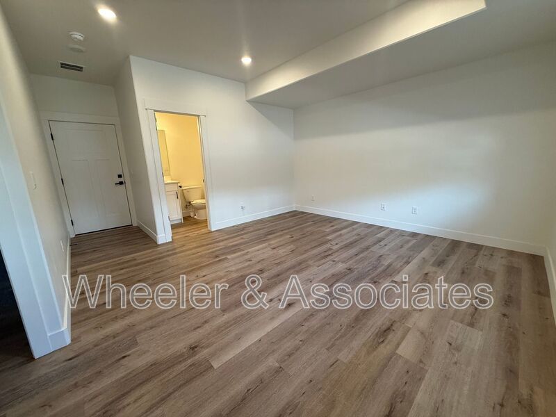 Spacious 3 bed 2 bath Condo with two .5 bathrooms, 2 car Garage and Bonus office space on Ground floor off 12th mouth of Weber Canyon. property image