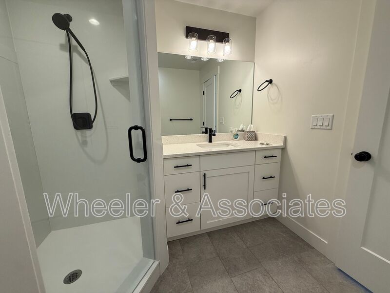 Spacious 3 bed 2 bath Condo with two .5 bathrooms, 2 car Garage and Bonus office space on Ground floor off 12th mouth of Weber Canyon. property image