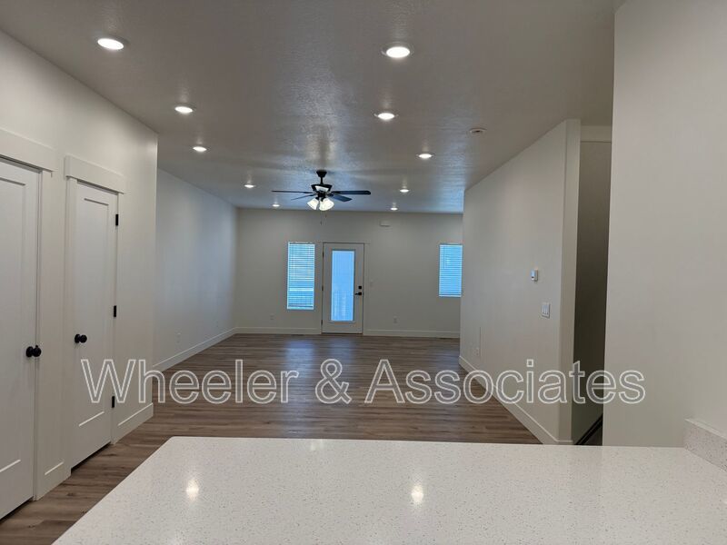 Spacious 3 bed 2 bath Condo with two .5 bathrooms, 2 car Garage and Bonus office space on Ground floor off 12th mouth of Weber Canyon. property image