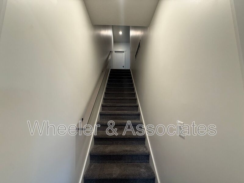 Spacious 3 bed 2 bath Condo with two .5 bathrooms, 2 car Garage and Bonus office space on Ground floor off 12th mouth of Weber Canyon. property image