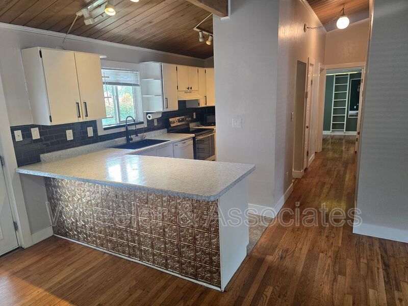 4 Bed, 1 Bath East Ogden Home | Mountain Views, Updated Kitchen + Vaulted Wood Ceilings property image