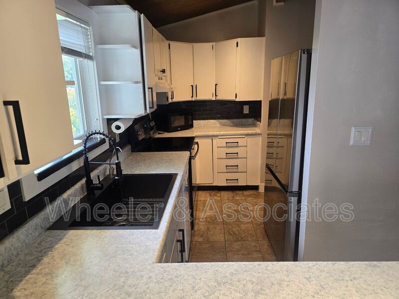 4 Bed, 1 Bath East Ogden Home | Mountain Views, Updated Kitchen + Vaulted Wood Ceilings property image